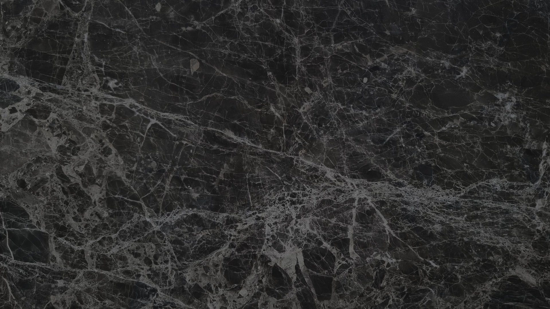 Black emperador marble surface with intricate grey veins