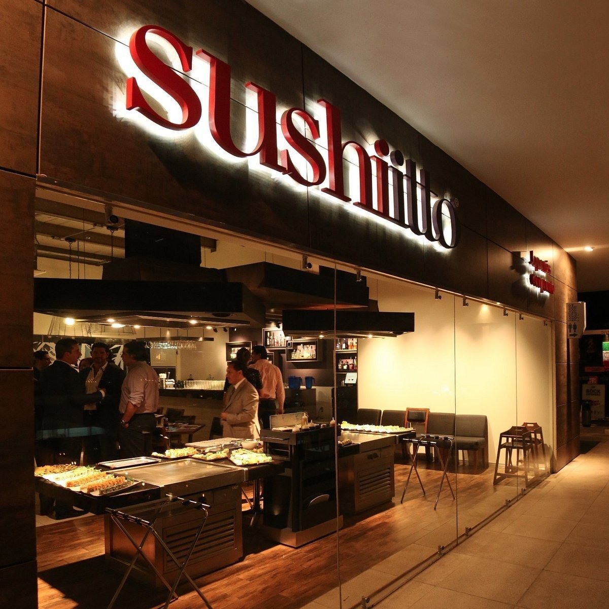 Sushitto restaurant storefront with glowing red neon sign