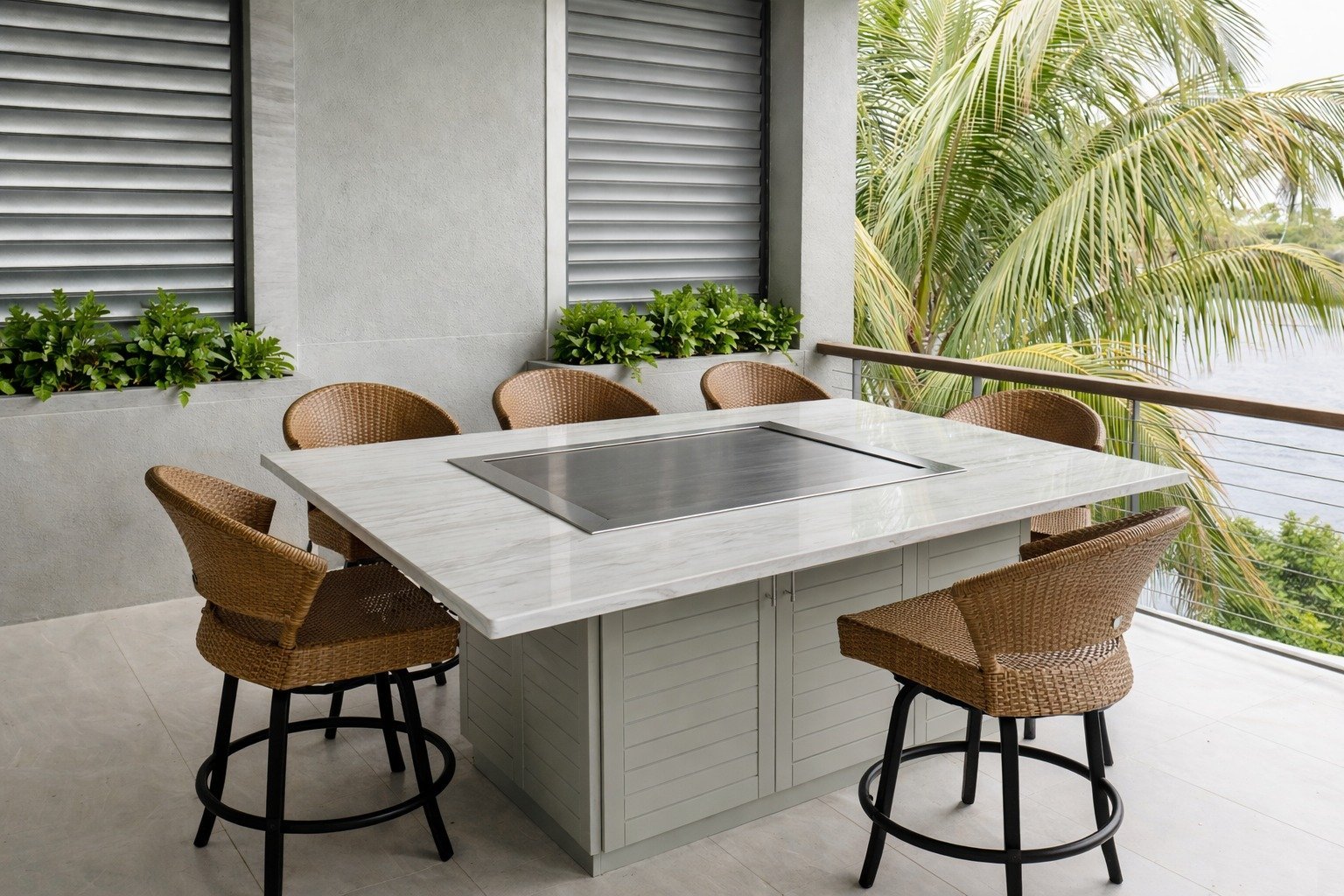 Modern outdoor dining area with white square table, woven rattan bar stools, potted plants, and palm tree view